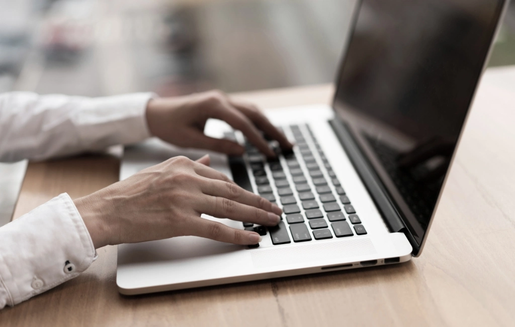 client using laptop to book a ride
